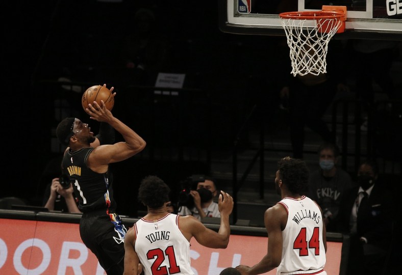 May 15, 2021; Brooklyn, New York, USA; Brooklyn Nets forward Bruce Brown (1) goes up for a shot as Chicago Bulls forward Thaddeus Young (21) and forward Patrick Williams (44) look on during the first half at Barclays Center. Mandatory Credit: Andy Marlin-USA TODAY Sports