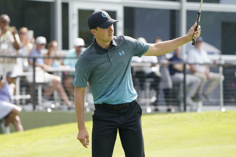 May 15, 2021; McKinney, Texas, USA; Jordan Spieth reacts on his eagle shot on the 18th green during the third round of the Byron Nelson golf tournament. Mandatory Credit: Jim Cowsert-USA TODAY Sports