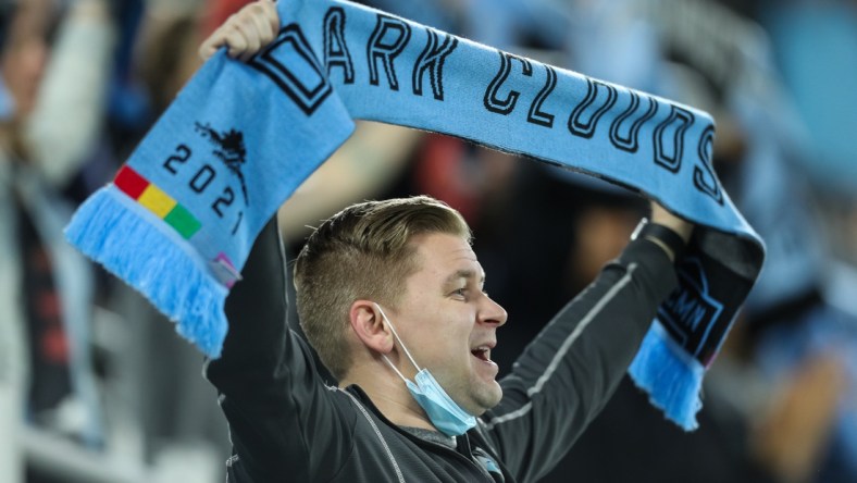 May 15, 2021; Saint Paul, MN, Saint Paul, MN, USA; A Minnesota United fan sings along to "Wonderwall" after Minnesota United defeated FC Dallas at Allianz Field. Mandatory Credit: David Berding-USA TODAY Sports