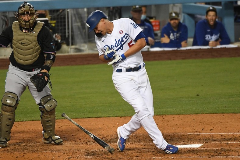 May 15, 2021; Los Angeles, California, USA; Los Angeles Dodgers shortstop Corey Seager (5) reacts after getting hit by a pitch in the fifth inning against the Miami Marlins at Dodger Stadium. Mandatory Credit: Richard Mackson-USA TODAY Sports