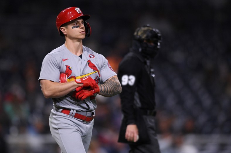 May 15, 2021; San Diego, California, USA; St. Louis Cardinals left fielder Tyler O'Neill (L) reacts after being hit by a pitch during the seventh inning against the San Diego Padres as home plate umpire Will Little (93) looks on at Petco Park. Mandatory Credit: Orlando Ramirez-USA TODAY Sports