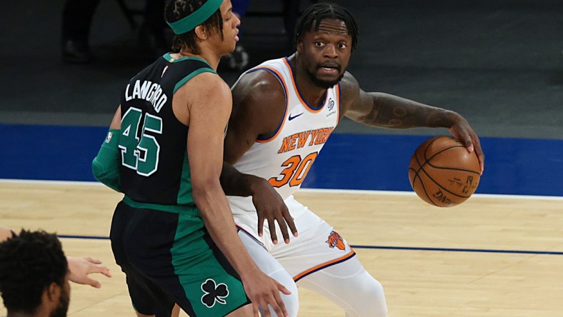 May 16, 2021; New York, New York, USA; New York Knicks forward Julius Randle (30) dribbles as Boston Celtics guard Romeo Langford (45) defends during the first quarter at Madison Square Garden. Mandatory Credit: Vincent Carchietta-USA TODAY Sports