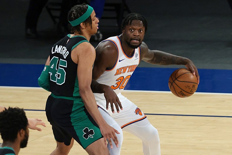 May 16, 2021; New York, New York, USA; New York Knicks forward Julius Randle (30) dribbles as Boston Celtics guard Romeo Langford (45) defends during the first quarter at Madison Square Garden. Mandatory Credit: Vincent Carchietta-USA TODAY Sports