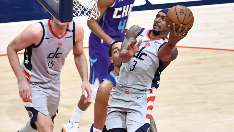 May 16, 2021; Washington, District of Columbia, USA; Washington Wizards guard Bradley Beal (3) shoots as Charlotte Hornets forward Miles Bridges (0) looks on during the second quarter at Capital One Arena. Mandatory Credit: Brad Mills-USA TODAY Sports