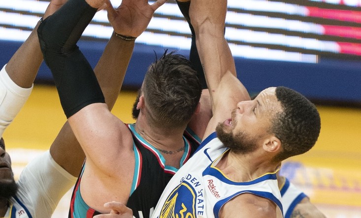 May 16, 2021; San Francisco, California, USA; Golden State Warriors guard Stephen Curry (30) blocks the shot attempt by Memphis Grizzlies center Jonas Valanciunas (17) during the first quarter at Chase Center. Mandatory Credit: Kyle Terada-USA TODAY Sports