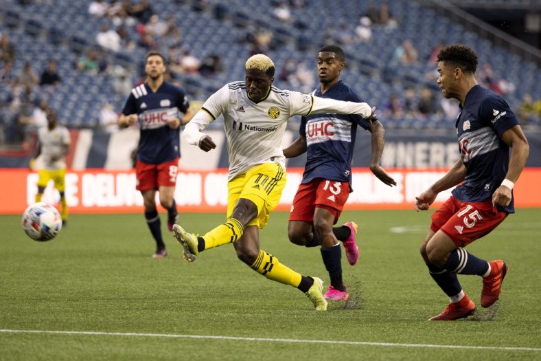 May 16, 2021; Foxborough, Massachusetts, USA; Columbus Crew forward Gyasi Zardes (11) lets go with a shot against the New England Revolution during the first half at Gillette Stadium. Mandatory Credit: Winslow Townson-USA TODAY Sports