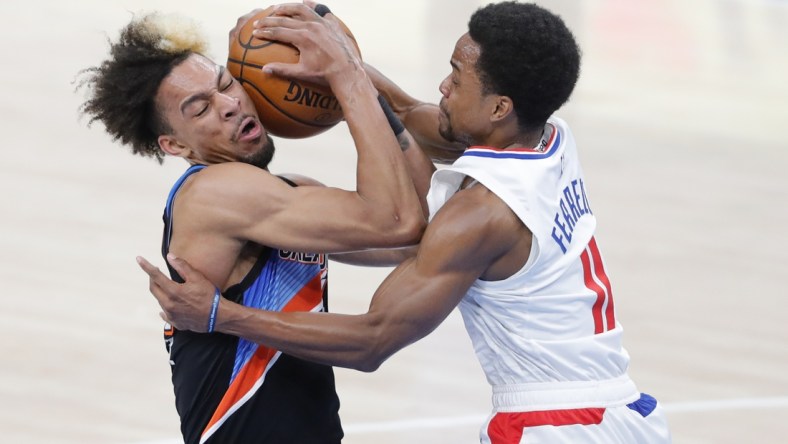 May 16, 2021; Oklahoma City, Oklahoma, USA; Oklahoma City Thunder forward Charlie Brown Jr. (44) and LA Clippers guard Yogi Ferrell (11) battle for the ball during the second quarter at Chesapeake Energy Arena. Mandatory Credit: Alonzo Adams-USA TODAY Sports