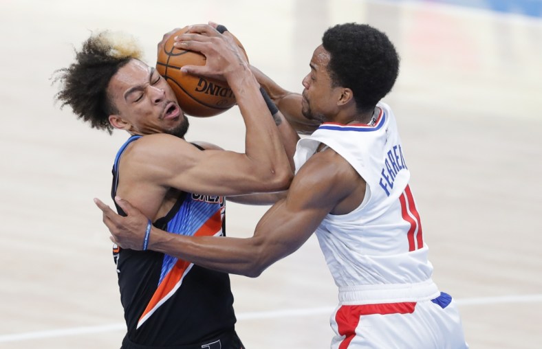 May 16, 2021; Oklahoma City, Oklahoma, USA; Oklahoma City Thunder forward Charlie Brown Jr. (44) and LA Clippers guard Yogi Ferrell (11) battle for the ball during the second quarter at Chesapeake Energy Arena. Mandatory Credit: Alonzo Adams-USA TODAY Sports