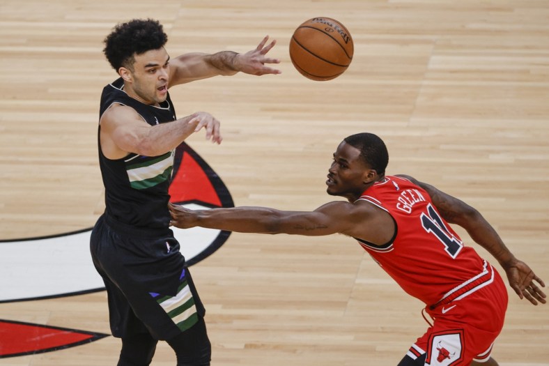 May 16, 2021; Chicago, Illinois, USA; Milwaukee Bucks guard Elijah Bryant (3) passes the ball against Chicago Bulls guard Javonte Green (11) during the first half at United Center. Mandatory Credit: Kamil Krzaczynski-USA TODAY Sports