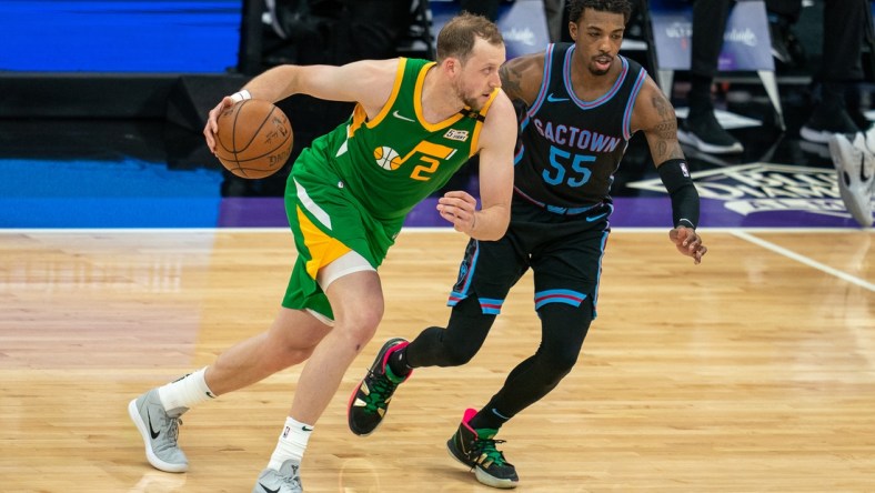 May 16, 2021; Sacramento, California, USA;  Utah Jazz guard Joe Ingles (2) drives in against Sacramento Kings guard Delon Wright (55) during the second quarter at Golden 1 Center. Mandatory Credit: Neville E. Guard-USA TODAY Sports