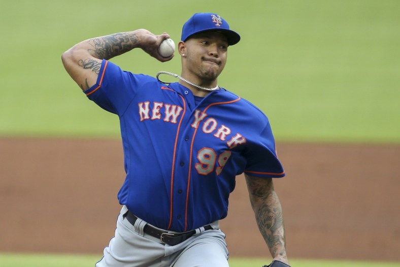 May 17, 2021; Atlanta, Georgia, USA; New York Mets starting pitcher Taijuan Walker (99) throws a pitch against the Atlanta Braves in the second inning at Truist Park. Mandatory Credit: Brett Davis-USA TODAY Sports