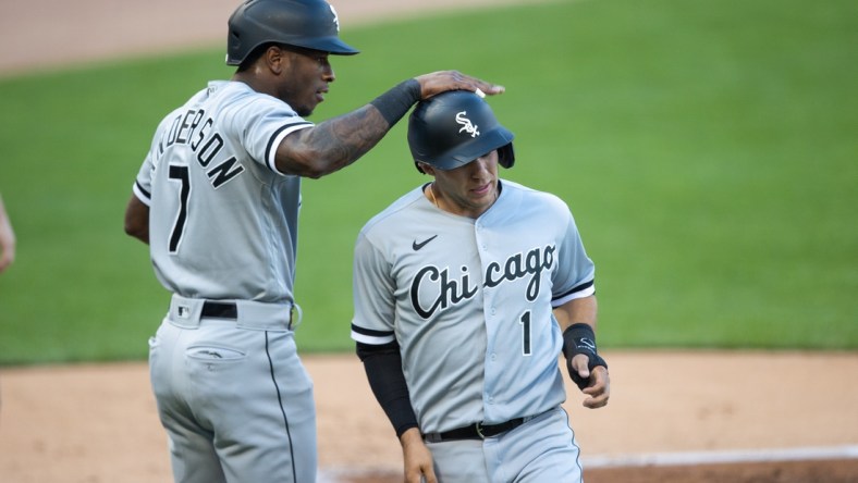 May 17, 2021; Minneapolis, Minnesota, USA; Chicago White Sox shortstop Tim Anderson (7) and second baseman Nick Madrigal (1) score during the first inning against the Minnesota Twins at Target Field. Mandatory Credit: Jordan Johnson-USA TODAY Sports