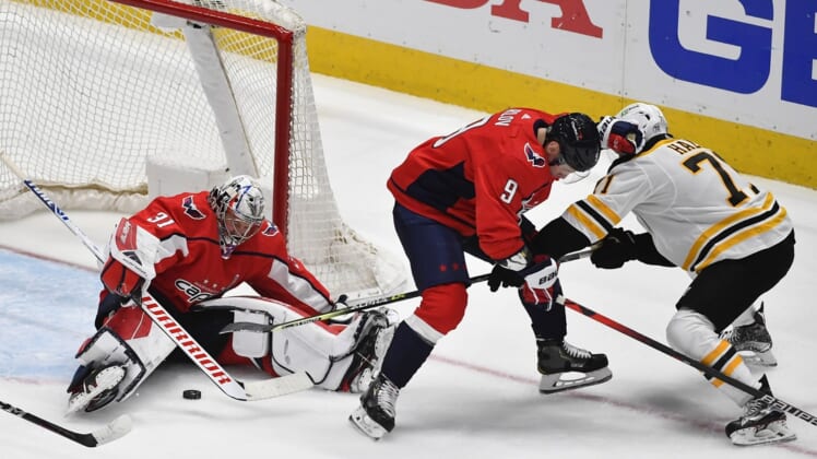 May 17, 2021; Washington, District of Columbia, USA; Washington Capitals goaltender Craig Anderson (31) makes a save against Boston Bruins left wing Taylor Hall (71) during the first period in game two of the first round of the 2021 Stanley Cup Playoffs at Capital One Arena. Mandatory Credit: Brad Mills-USA TODAY Sports