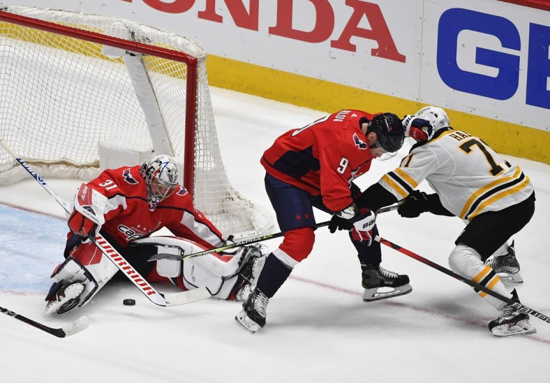 May 17, 2021; Washington, District of Columbia, USA; Washington Capitals goaltender Craig Anderson (31) makes a save against Boston Bruins left wing Taylor Hall (71) during the first period in game two of the first round of the 2021 Stanley Cup Playoffs at Capital One Arena. Mandatory Credit: Brad Mills-USA TODAY Sports