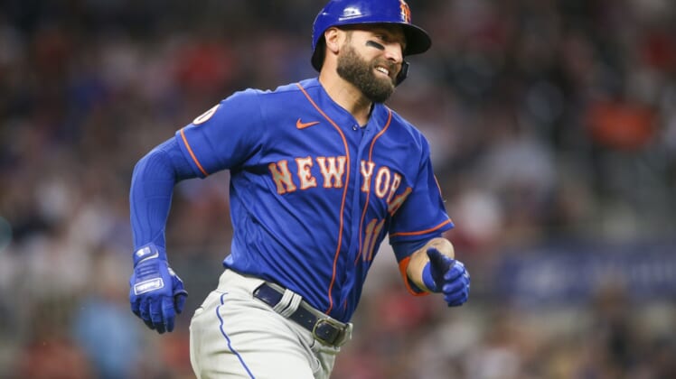 May 17, 2021; Atlanta, Georgia, USA; New York Mets center fielder Kevin Pillar (11) runs to first after hitting a double against the Atlanta Braves in the sixth inning at Truist Park. Mandatory Credit: Brett Davis-USA TODAY Sports