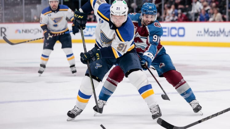 May 17, 2021; Denver, Colorado, USA; St. Louis Blues right wing Vladimir Tarasenko (91) controls the puck ahead of Colorado Avalanche center Nazem Kadri (91) in the first period in game one of the first round of the 2021 Stanley Cup Playoffs at Ball Arena. Mandatory Credit: Isaiah J. Downing-USA TODAY Sports