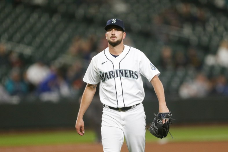 May 17, 2021; Seattle, Washington, USA; Seattle Mariners relief pitcher Brady Lail (62) walks to the dugout following the ninth inning against the Detroit Tigers at T-Mobile Park. Mandatory Credit: Joe Nicholson-USA TODAY Sports
