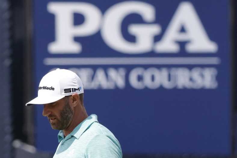 May 18, 2021; Kiawah Island, South Carolina, USA; Dustin Johnson stands on the ninth green during a practice round for the PGA Championship golf tournament at Ocean Course at Kiawah Island Resort. Mandatory Credit: Geoff Burke-USA TODAY Sports