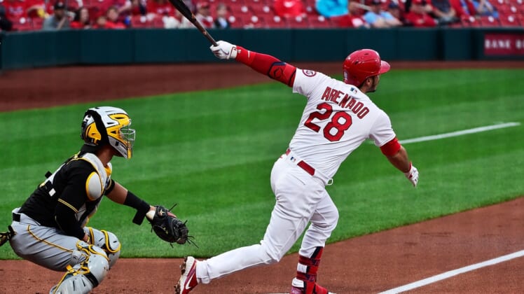 May 18, 2021; St. Louis, Missouri, USA;  St. Louis Cardinals third baseman Nolan Arenado (28) hits a two run home run during the first inning against the Pittsburgh Pirates at Busch Stadium. Mandatory Credit: Jeff Curry-USA TODAY Sports