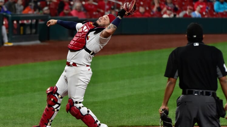 May 18, 2021; St. Louis, Missouri, USA;  St. Louis Cardinals catcher Yadier Molina (4) catches a foul ball during the sixth inning against the Pittsburgh Pirates at Busch Stadium. Mandatory Credit: Jeff Curry-USA TODAY Sports