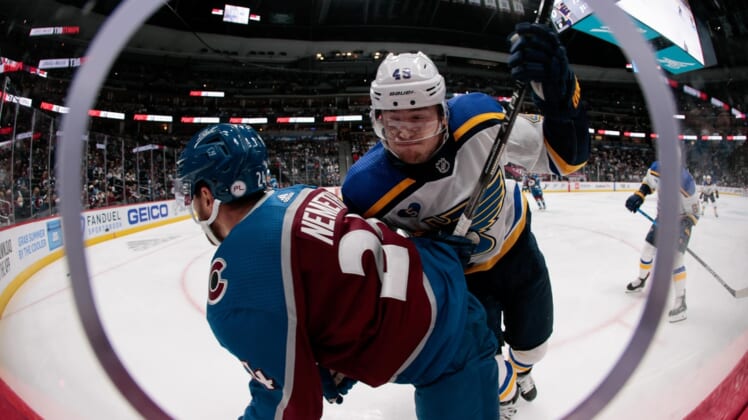 May 19, 2021; Denver, Colorado, USA; St. Louis Blues center Ivan Barbashev (49) check Colorado Avalanche defenseman Patrik Nemeth (24) into the boards in the first period in game two of the first round of the 2021 Stanley Cup Playoffs at Ball Arena. Mandatory Credit: Isaiah J. Downing-USA TODAY Sports