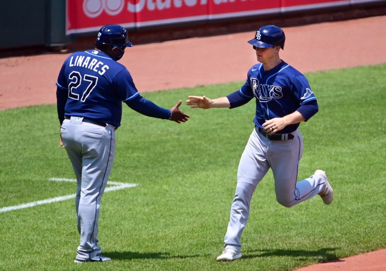 May 20, 2021; Baltimore, Maryland, USA; Tampa Bay Rays shortstop Joey Wendle (18) high fives third base coach Rodney Linares (27) after hitting a home run in the second inning against the Baltimore Orioles at Oriole Park at Camden Yards. Mandatory Credit: Evan Habeeb-USA TODAY Sports