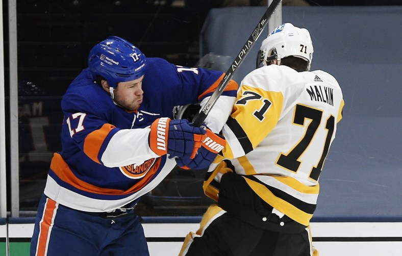 May 20, 2021; Uniondale, New York, USA; New York Islanders left wing Matt Martin (17) and Pittsburgh Penguins center Evgeni Malkin (71) come together during the second period in game three of the first round of the 2021 Stanley Cup Playoffs at Nassau Veterans Memorial Coliseum. Mandatory Credit: Andy Marlin-USA TODAY Sports