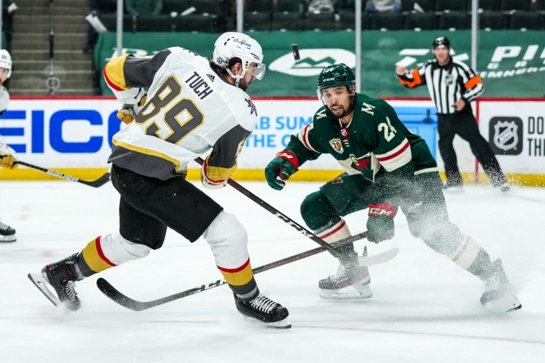 May 20, 2021; Saint Paul, Minnesota, USA; Minnesota Wild defenseman Matt Dumba (24) blocks a shot from Vegas Golden Knights forward Alex Tuch (89) during the first period in game three of the first round of the 2021 Stanley Cup Playoffs at Xcel Energy Center. Mandatory Credit: Brace Hemmelgarn-USA TODAY Sports