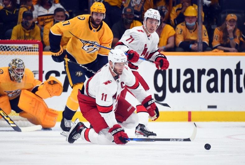 May 21, 2021; Nashville, Tennessee, USA; Carolina Hurricanes center Jordan Staal (11) tries to play the puck during the first period against the Nashville Predators in game three of the first round of the 2021 Stanley Cup Playoffs at Bridgestone Arena. Mandatory Credit: Christopher Hanewinckel-USA TODAY Sports