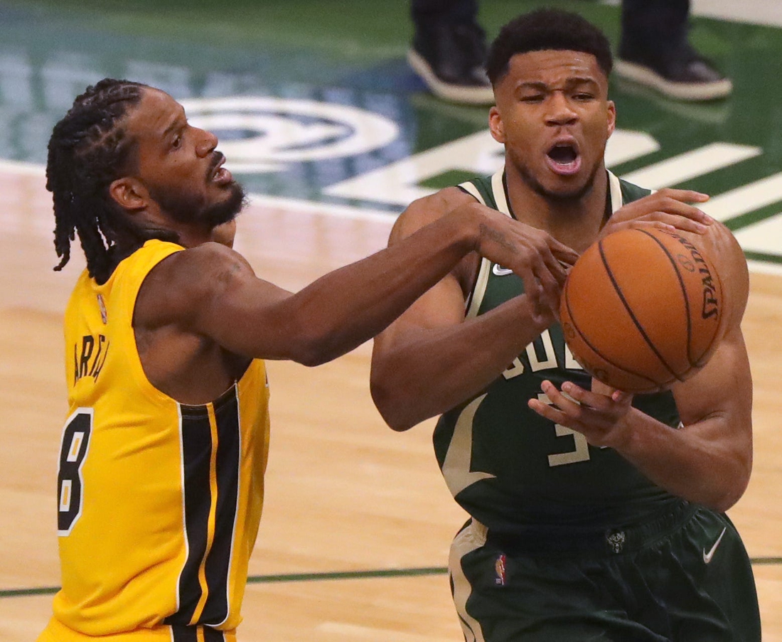 Heat forward Trevor Ariza swats the ball away from Bucks forward Giannis Antetokounmpo on Saturday.

Mjs Bucks23 3 Jpg Bucks23