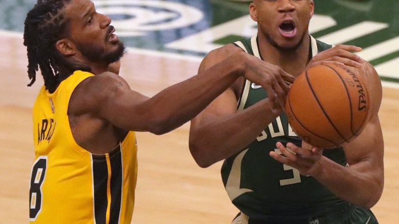 Heat forward Trevor Ariza swats the ball away from Bucks forward Giannis Antetokounmpo on Saturday.

Mjs Bucks23 3 Jpg Bucks23