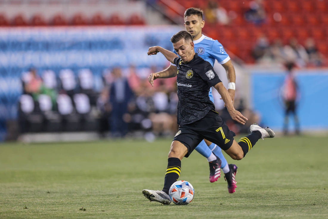 May 22, 2021; Harrison, New Jersey, USA; Columbus Crew forward Pedro Santos (7) kicks the ball against New York City FC during the first half at Red Bull Arena. Mandatory Credit: Vincent Carchietta-USA TODAY Sports