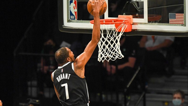 May 22, 2021; Brooklyn, New York, USA;  Brooklyn Nets forward Kevin Durant (7) dunks the ball against the Boston Celtics during the second quarter of game one in the first round of the 2021 NBA Playoffs. at Barclays Center. Mandatory Credit: Dennis Schneidler-USA TODAY Sports