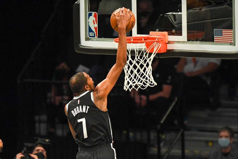 May 22, 2021; Brooklyn, New York, USA;  Brooklyn Nets forward Kevin Durant (7) dunks the ball against the Boston Celtics during the second quarter of game one in the first round of the 2021 NBA Playoffs. at Barclays Center. Mandatory Credit: Dennis Schneidler-USA TODAY Sports