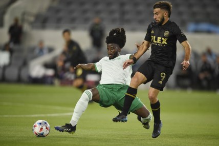 May 22, 2021; Los Angeles, CA, USA; Colorado Rapids defender Lalas Abubakar (6) lunges for the ball against Los Angeles FC forward Diego Rossi (9) during the first half at Banc of California Stadium. Mandatory Credit: Kelvin Kuo-USA TODAY Sports