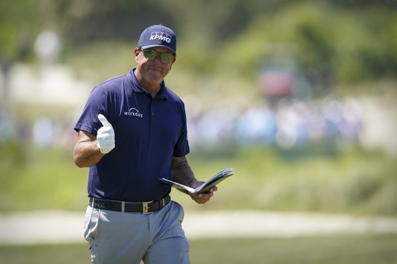 May 23, 2021; Kiawah Island, South Carolina, USA; Phil Mickelson gives a thumbs up to the fans while walking on the 2nd hole fairway during the final round of the PGA Championship golf tournament. Mandatory Credit: David Yeazell-USA TODAY Sports