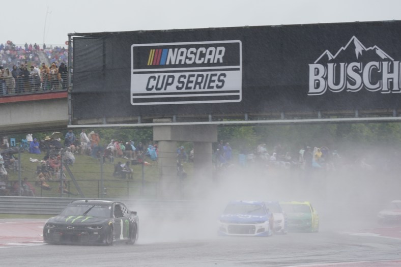 May 23, 2021; Austin, Texas, USA; Kurt Busch (1) drives with poor visibility around turn three in the EchoPark Texas Grand Prix at Circuit of the Americas. Mandatory Credit: Scott Wachter-USA TODAY Sports