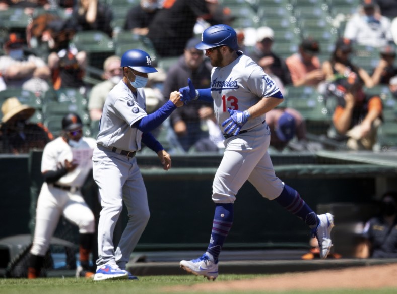 May 23, 2021; San Francisco, California, USA; Los Angeles Dodgers second baseman Max Muncy (13) gets a fist bump from third base coach Dino Ebel after hitting a solo home run against the San Francisco Giants during the fourth inning at Oracle Park. Mandatory Credit: D. Ross Cameron-USA TODAY Sports