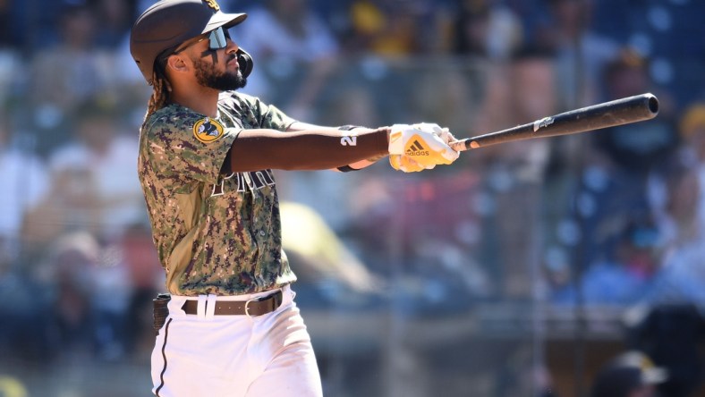 May 23, 2021; San Diego, California, USA; San Diego Padres shortstop Fernando Tatis Jr. (23) watches his grand slam home run against the Seattle Mariners during the seventh inning at Petco Park. Mandatory Credit: Orlando Ramirez-USA TODAY Sports