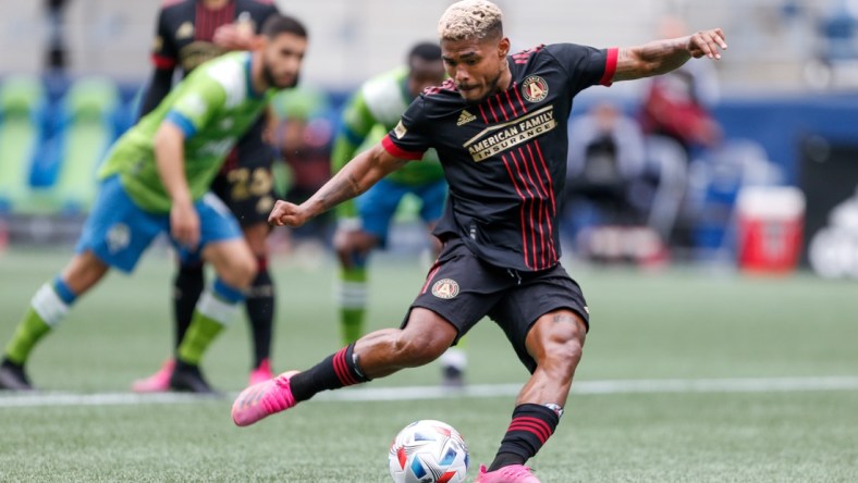 May 23, 2021; Seattle, Washington, USA; Atlanta United FC forward Josef Martinez (7) scores the tying goal on a penalty kick against the Seattle Sounders FC during the second half at Lumen Field. Mandatory Credit: Jennifer Buchanan-USA TODAY Sports