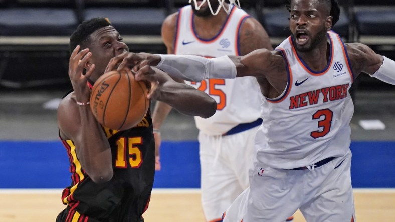 May 23, 2021; New York, New York, USA; New York Knicks center Nerlens Noel (3) fouls Atlanta Hawks center Clint Capela (15) during the second half in game one in the first round of the 2021 NBA Playoffs at Madison Square Garden. Mandatory Credit: Seth Wenig/Pool Photo-USA TODAY Sports