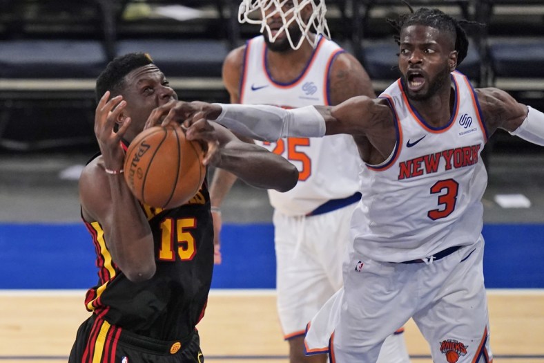 May 23, 2021; New York, New York, USA; New York Knicks center Nerlens Noel (3) fouls Atlanta Hawks center Clint Capela (15) during the second half in game one in the first round of the 2021 NBA Playoffs at Madison Square Garden. Mandatory Credit: Seth Wenig/Pool Photo-USA TODAY Sports