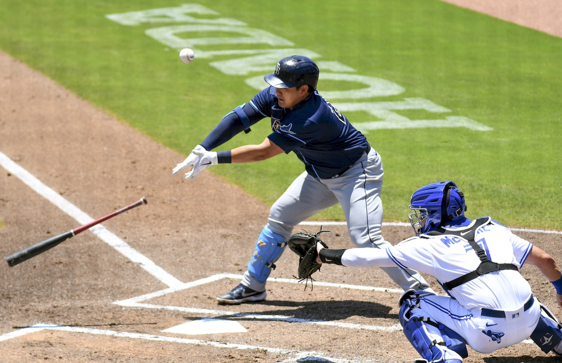 May 24, 2021; Dunedin, Florida, CAN; Tampa Bay Rays infielder Ji-Man Choi (26) loses his bat in the first inning against the Toronto Blue Jays at TD Ballpark. Mandatory Credit: Jonathan Dyer-USA TODAY Sports