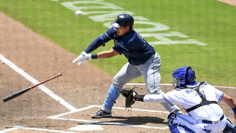 May 24, 2021; Dunedin, Florida, CAN; Tampa Bay Rays infielder Ji-Man Choi (26) loses his bat in the first inning against the Toronto Blue Jays at TD Ballpark. Mandatory Credit: Jonathan Dyer-USA TODAY Sports