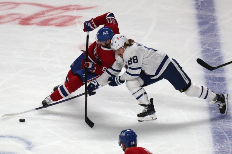 May 24, 2021; Montreal, Quebec, CAN; Toronto Maple Leafs center William Nylander (88) and Montreal Canadiens defenseman Ben Chiarot (8) battle for the puck during the first period of the game three of the first round of the 2021 Stanley Cup Playoffs at Bell Centre. Mandatory Credit: Jean-Yves Ahern-USA TODAY Sports