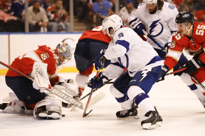 May 24, 2021; Sunrise, Florida, USA; Tampa Bay Lightning center Tyler Johnson (9) shoots the puck against Florida Panthers goaltender Spencer Knight (30) during the first period in game five of the first round of the 2021 Stanley Cup Playoffs at BB&T Center. Mandatory Credit: Sam Navarro-USA TODAY Sports