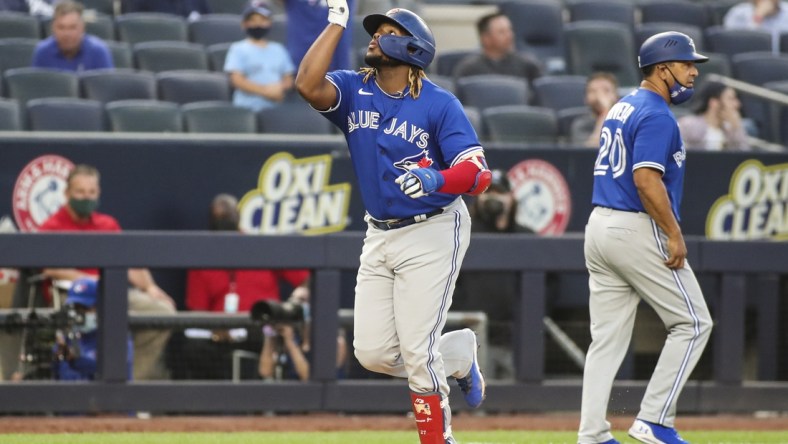 May 25, 2021; Bronx, New York, USA; Toronto Blue Jays first baseman Vladimir Guerrero Jr. (27) points to the sky after hitting a two run home in the third inning against the New York Yankees at Yankee Stadium. Mandatory Credit: Wendell Cruz-USA TODAY Sports