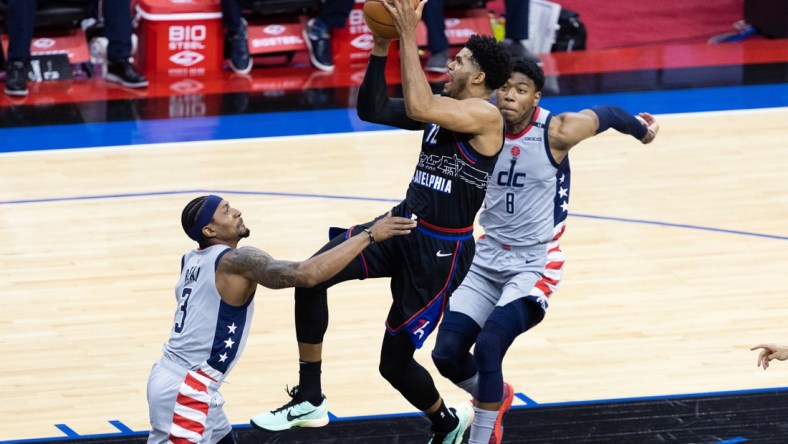 May 26, 2021; Philadelphia, Pennsylvania, USA; Philadelphia 76ers forward Tobias Harris (12) moves to the basket against Washington Wizards guard Bradley Beal (3) and forward Rui Hachimura (8) during the first quarter of game two in the first round of the 2021 NBA Playoffs at Wells Fargo Center. Mandatory Credit: Bill Streicher-USA TODAY Sports