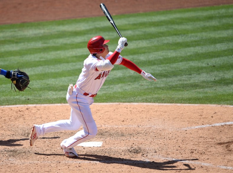 May 26, 2021; Anaheim, California, USA;  Los Angeles Angels designated hitter Shohei Ohtani (17) gets an infield hit in the sixth inning of the game against the Texas Rangers at Angel Stadium. Mandatory Credit: Jayne Kamin-Oncea-USA TODAY Sports