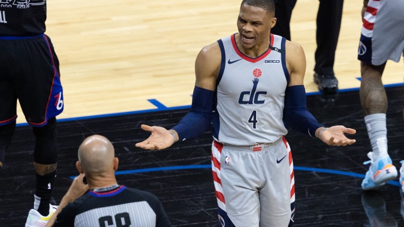 May 26, 2021; Philadelphia, Pennsylvania, USA; Washington Wizards guard Russell Westbrook (4) argues a call with referee Jacyn Goble (68) during the fourth quarter of game two against the Philadelphia 76ers in the first round of the 2021 NBA Playoffs at Wells Fargo Center. Mandatory Credit: Bill Streicher-USA TODAY Sports